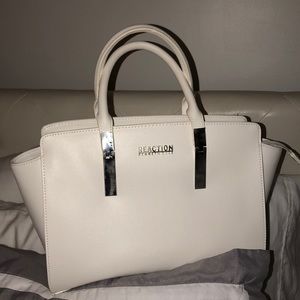 All white exterior with silver trim handbag.